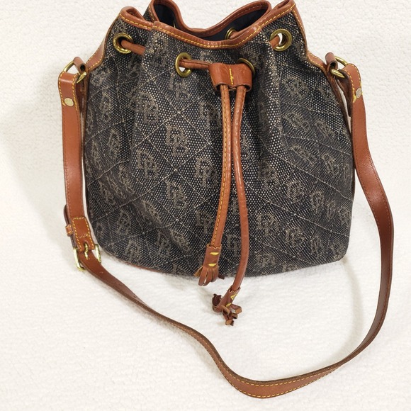 Dooney & Bourke Handbags - Dooney and Bourke Bucket Bag Medium Black Tan Monogram‎ Vintage Crossbody USA